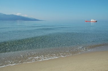 Ship sailing between Keramoti and Thassos island. Greece clipart