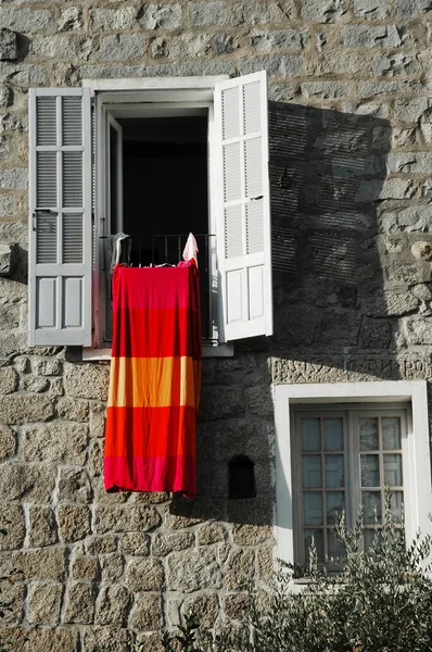 stock image Open window with bedclothes