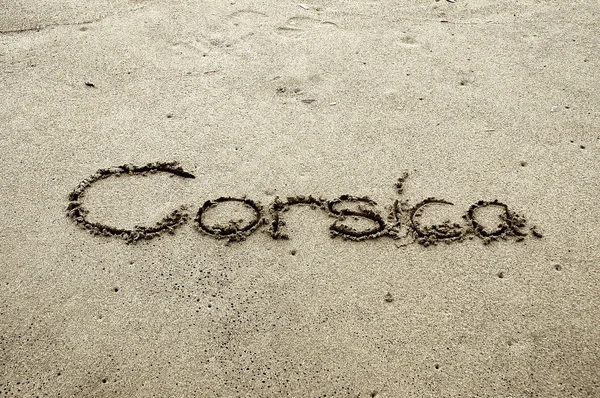 Korsika, kirjaimia hiekalla — kuvapankkivalokuva