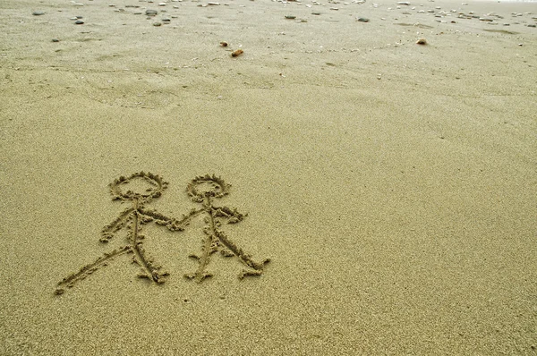 stock image Simple couple drawing in the sand on the beach