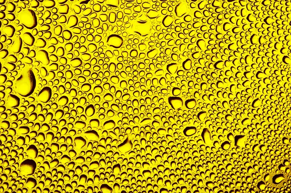 Abstrakt luftbubblor på gul bakgrund — Stockfoto