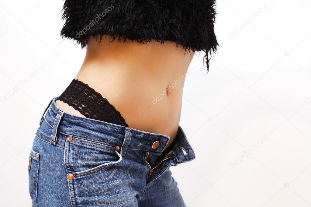 Slim woman with blue jeans isolated on white