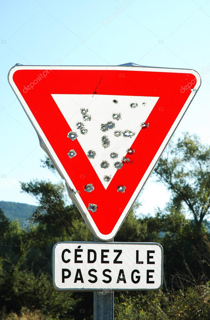 depositphotos_8412329-stock-photo-bullet-holes-on-road-sign.jpg