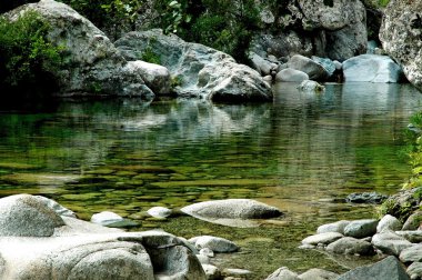 Beautiful quiet water stream in Purcaraccia canyon, Corsica, France clipart