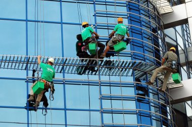 Workers washing the windows facade clipart