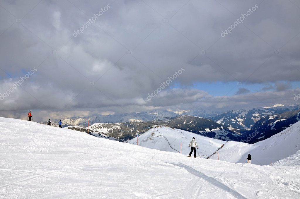 Skiers on the slope in Saalbach ski resort, Austrian Alps