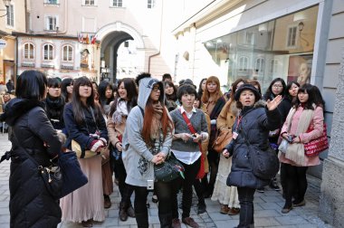 A group of Japanese tourists in Salzburg, Austria clipart