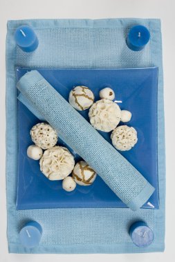 BLUE STILL LIFE WITH COTTON FLOWERS CANDLES and white cotton balls clipart