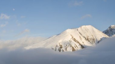 Summit over the clouds clipart