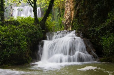 Waterfall in the forest clipart