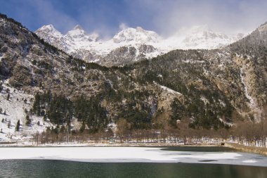 Frozen lake in the Pyrenees clipart
