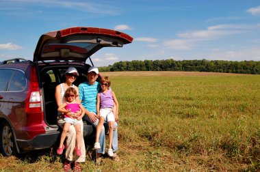 Family car trip on summer vacation clipart