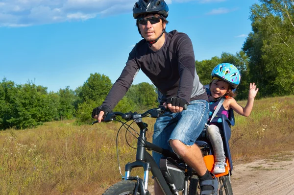 Active family cycling outdoors — Stock Photo, Image