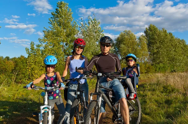 Active family cycling outdoors — Stock Photo, Image