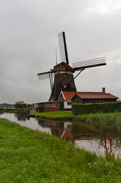 stock image Beautiful Dutch windmill and canal, Holland