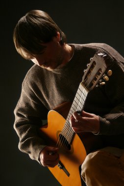 Guitarist. Man playing acoustic guitar clipart