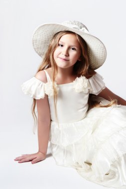 Pretty child girl in white dress and hat fashion clipart