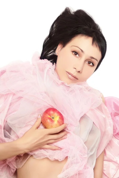 Mode kvinna i rosa med äpple. — Stockfoto