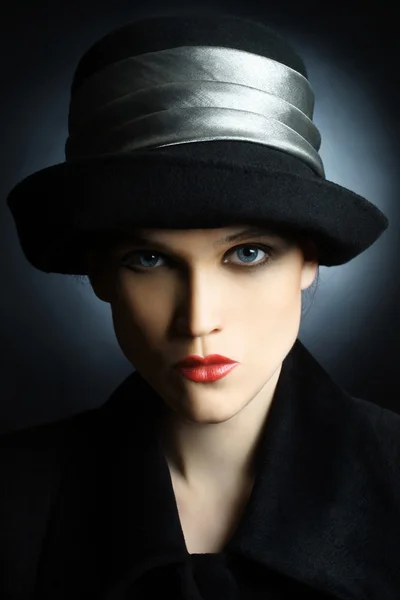 Fashion portrait of beautiful looking woman in black hat — Stock Photo, Image