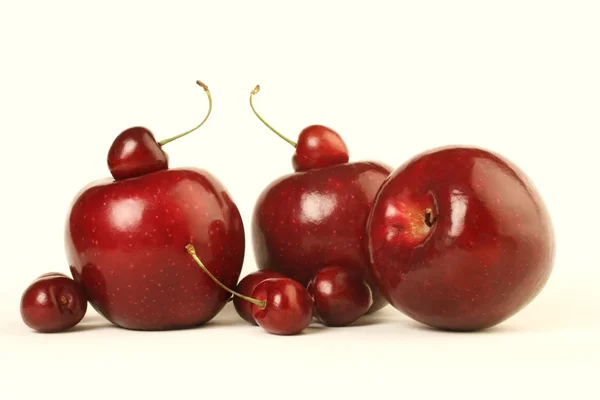 Red apples and cherries — Stock Photo, Image