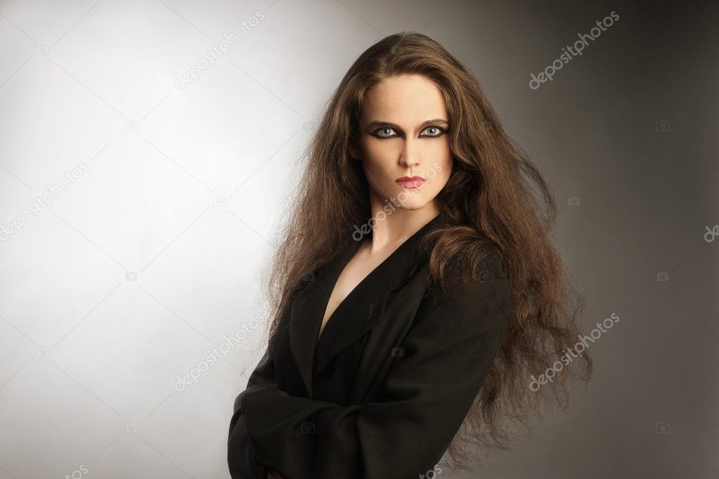 Fashion portrait of beautiful woman with long thick hair