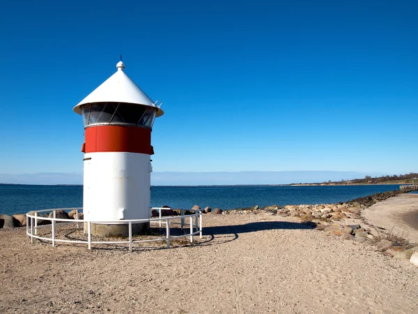 Small Lighthouse by the sea shore — Stock Photo, Image