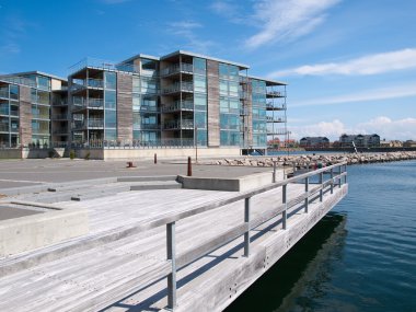 Modern seaside waterfront apartments building clipart