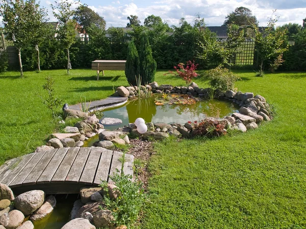 Beautiful classical garden fish pond gardening background — Stock Photo, Image