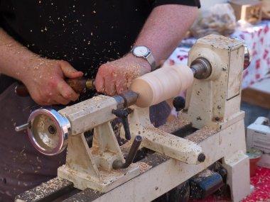 Wood turning craft on a lathe clipart