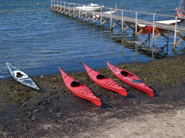 Sea kayaks on the beach