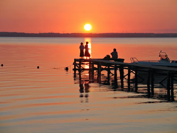 On a dock in sunset — Stock Photo, Image