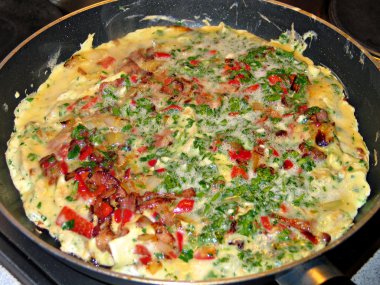 Omelette with ham and vegetables clipart