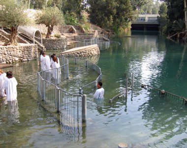 Baptism ceremony Jordan River Holyland clipart