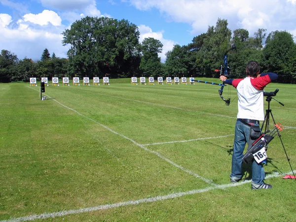 Archery competition - archer shooting — Stock Photo, Image