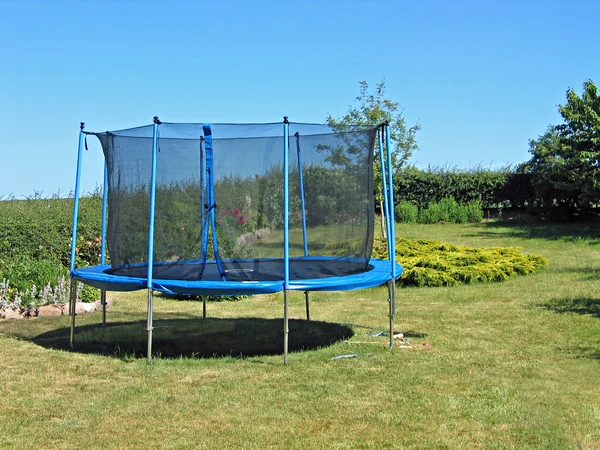 Trampoline in a garden — Stock Photo, Image