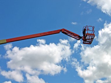 Tall mobile crane with sky background clipart