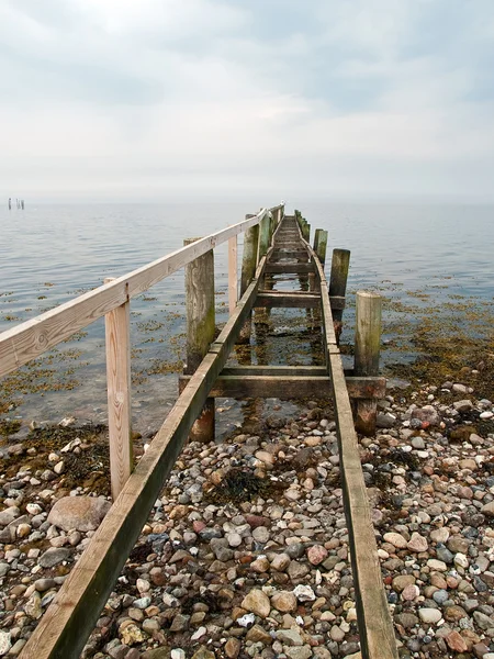 Dramatic beautiful seascape with a footbridge — Stock Photo, Image