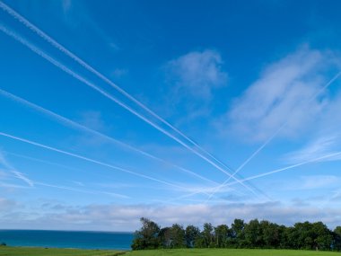 Aerial crossroad sky with jets contrails traffic clipart