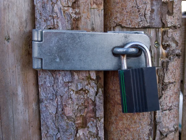 Door with heavy lock padlock — Stock Photo, Image
