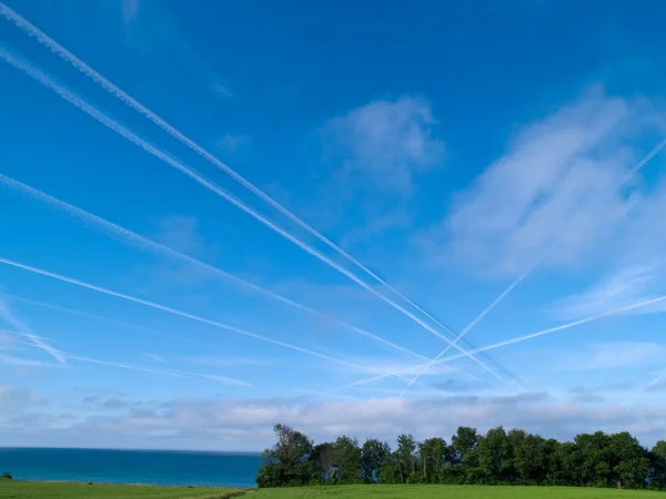 Aerial crossroad sky with jets contrails traffic — Stock Photo, Image