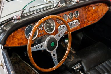 Interior and dashboard on a vintage sports car clipart