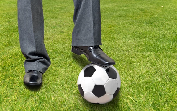 stock image Busyness men playinng with ball on the grass