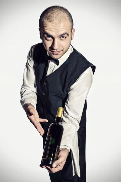 Waiter offers red wine — Stock Photo, Image