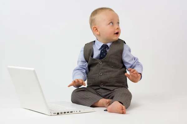 Baby with Laptop Looks into Copy Space — Stock Photo, Image