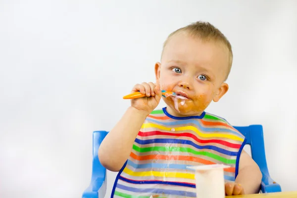 Messy Faced Infant Eating — Stock Photo, Image