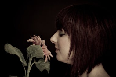 Girl Smelling Sunflower