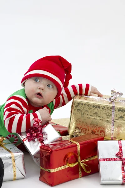 Bebé festivo en regalos —  Fotos de Stock