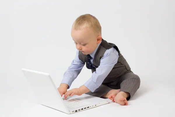 Бізнес дитини на комп'ютері Ліцензійні Стокові Фото