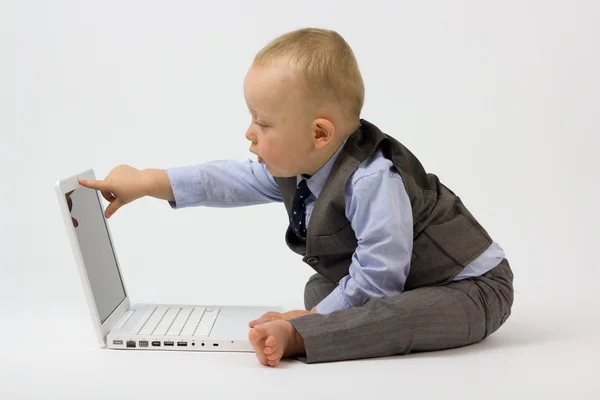 Baby Points at Laptop Screen Royalty Free Stock Photos