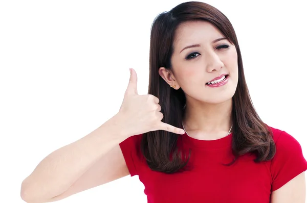 Cute young woman winking and making a call me gesture — Stock Photo, Image